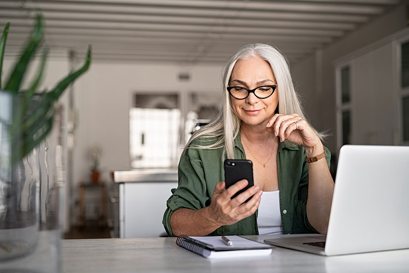 Woman using her phone to manage her bank account