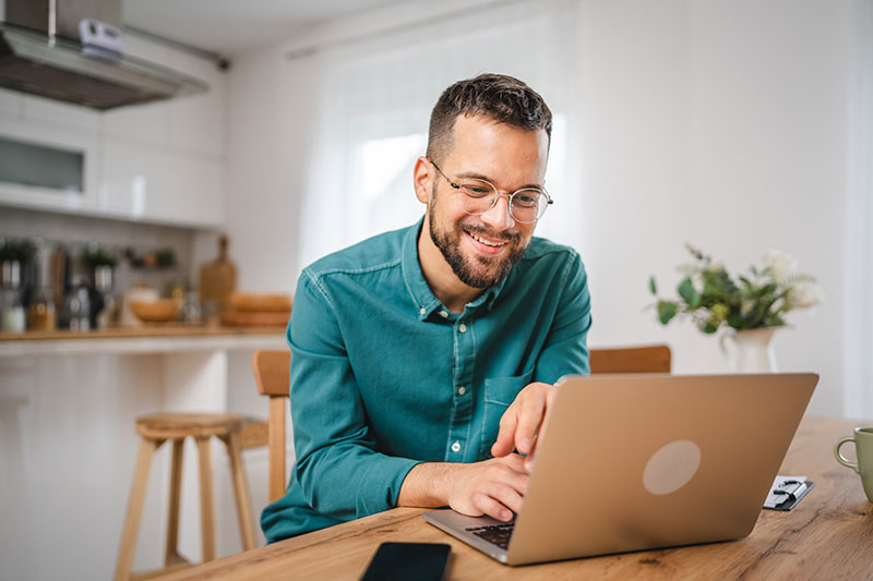 Man looking at laptop computer for online banking