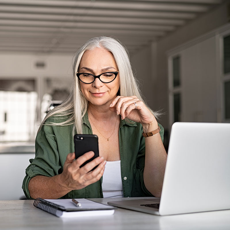 Woman using her phone to manage her bank account