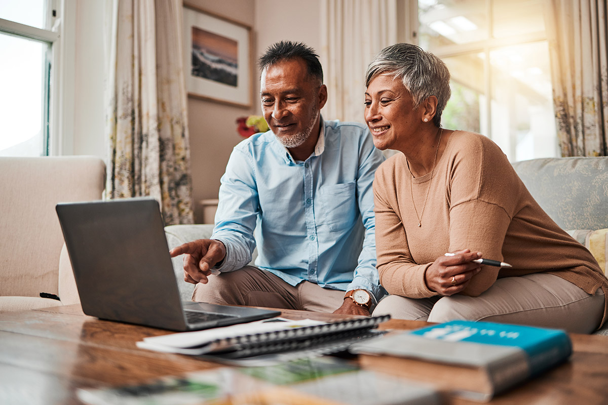 older couple reviewing investments online