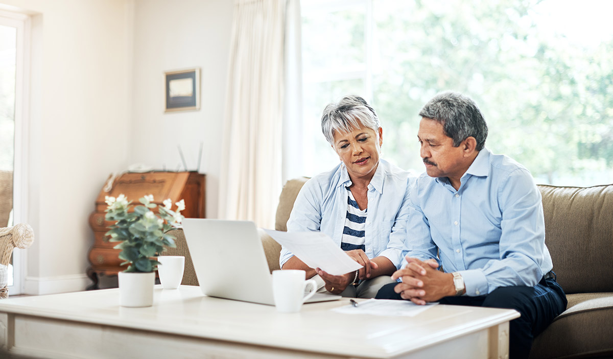 older couple reviewing investments online